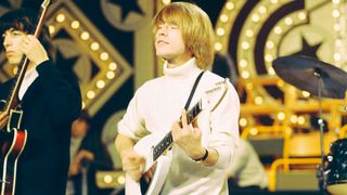 English musician and guitarist Brian Jones (1942-1969) of rock group The Rolling Stones plays a Vox Mark VI Teardrop guitar on the set of the ABC Television pop music television show Thank Your Lucky Stars at Alpha Television Studios in Birmingham, England on 6th June 1965. The band would play three songs on the show, I'm Alright, I'm Moving On and Route 66, which would be broadcast on 12th June.