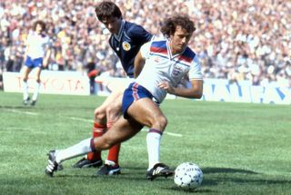 Scotland's Alan Hansen competes for the ball with England's Trevor Francis in 1982.