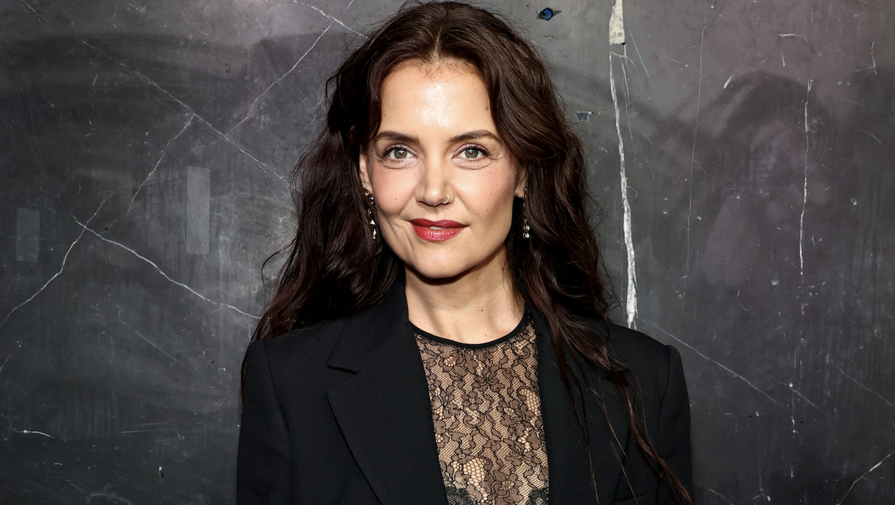 katie holmes wears a black lace top and matching blazer on the red carpet