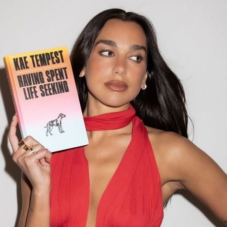 Dua Lipa hops on the strawberry red trend and pairs it with distressed denim, a key Spring 2026 crazy