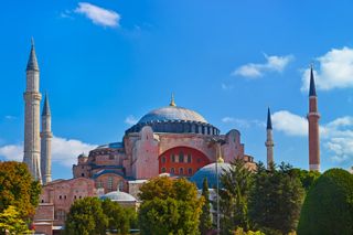 The Hagia Sophia is a domed monument built as a cathedral and is now a museum in Istanbul, Turkey.