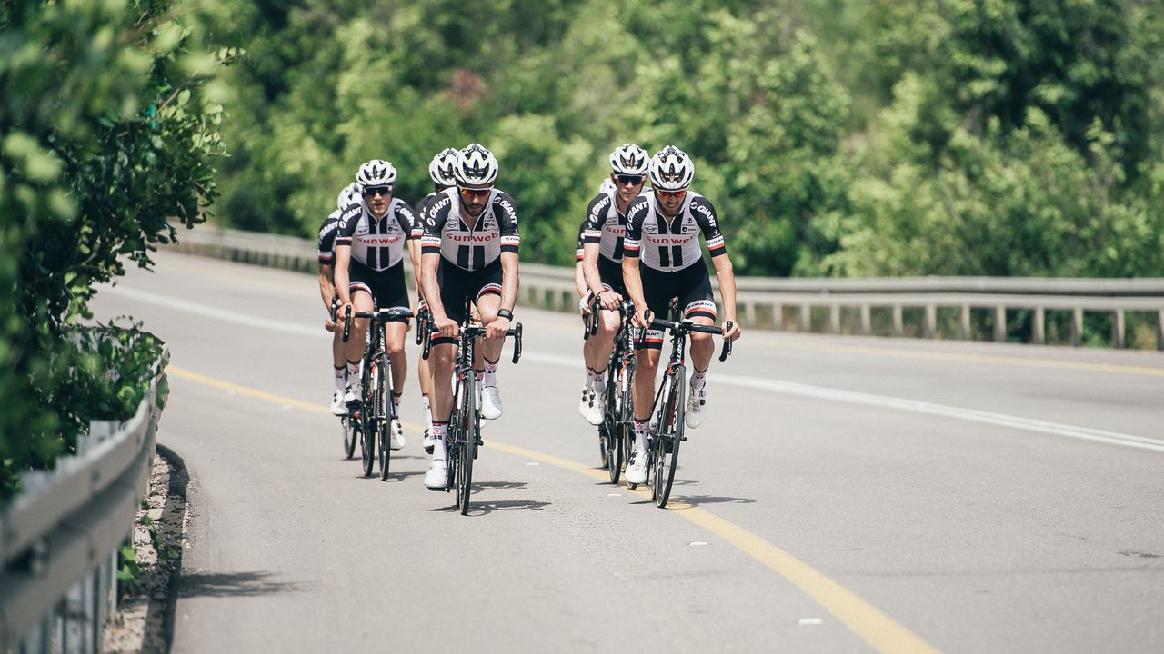 The riders head out of the town centre for some kilometres on calmer roads