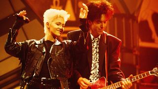 L-R: Marie Fredriksson and Per Gessle of Roxette perform on stage at the Smash Hits Poll Winners Party, Docklands Arena, London, 11th November 1990. (Photo by Phil Dent/Redferns)