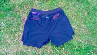 The rear of the Columbia Men’s Titan Ultra II Shorts on grass