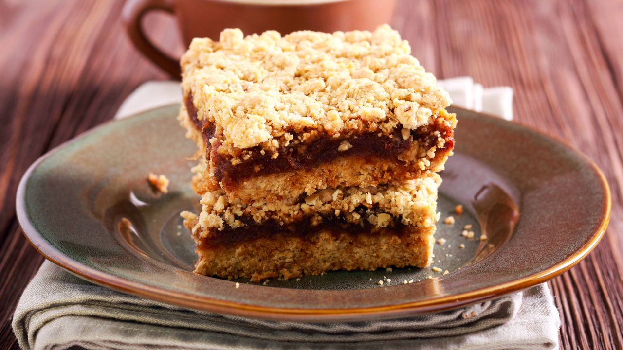 Maple syrup flapjacks with date centre stacked on a plate