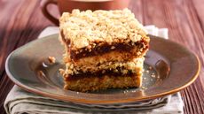 Maple syrup flapjacks with date centre stacked on a plate
