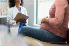 A woman discussing the potential complications of being pregnant and fibroids with a doctor