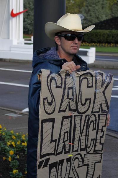 A protester pickets in front of the Nike World Headquarters campus in Beaverton, Oregon, on Oct. 16, 2012