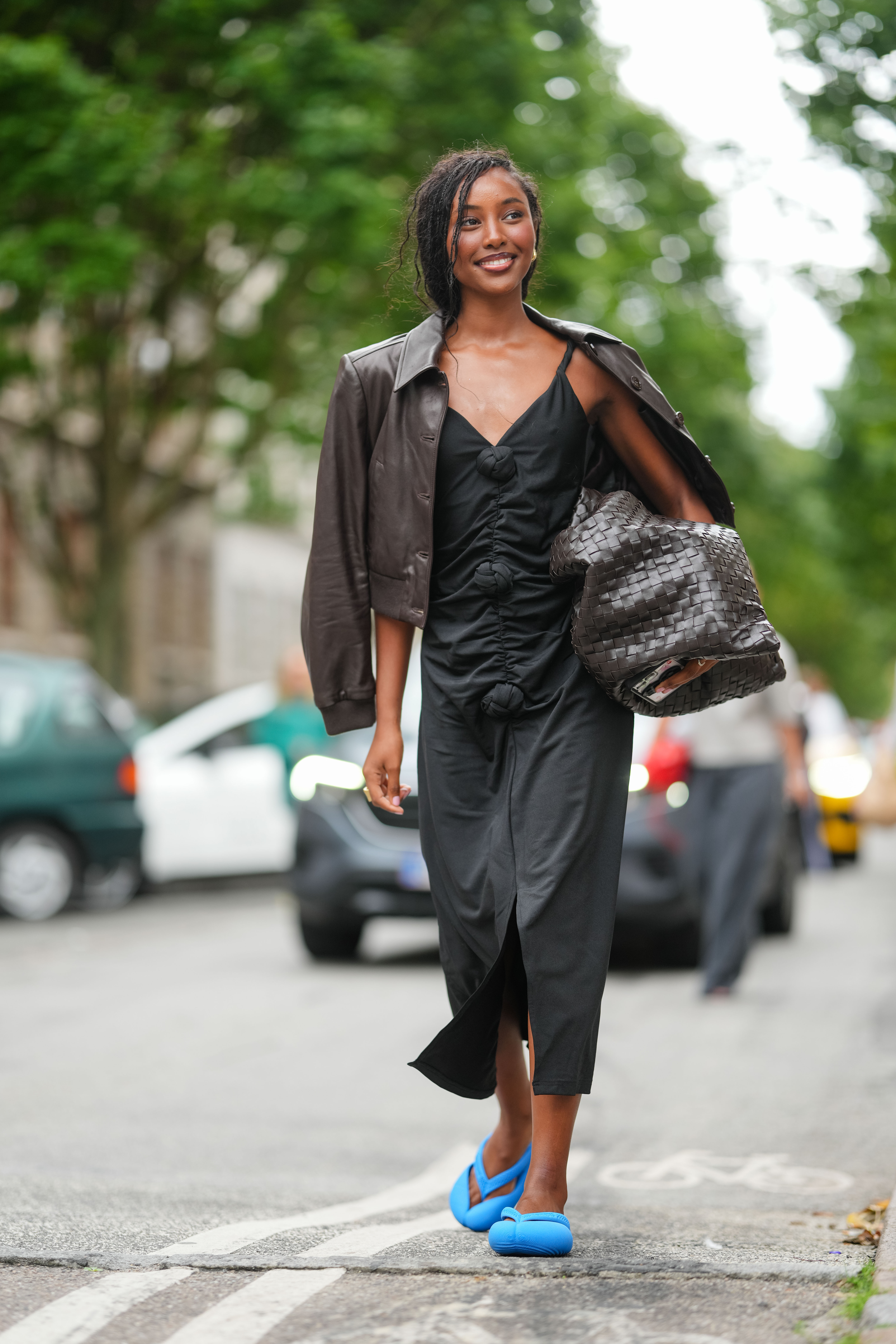women walking through Copenhagen wearing flip flops with fall dresses