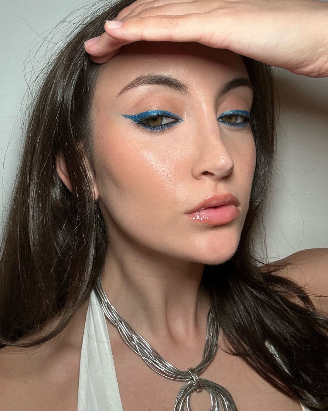Alyssa Brascia wearing blue metallic eyeliner.