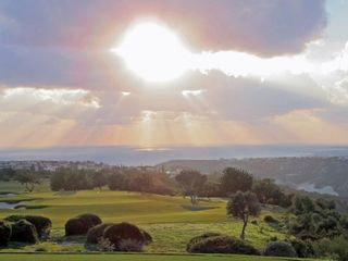 The sun sets over Aphrodite Hills