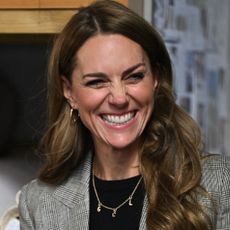 Kate Middleton attends engagement in in Sudbury wearing a plaid suit