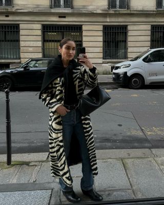 Géraldine Boublil wearing a zebra coat