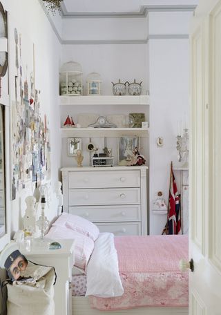 children's bedroom with pink bed and white chest of drawers
