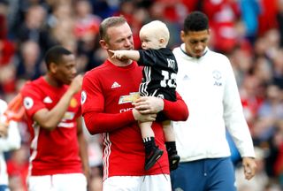 Rooney and son Kit after his final Premier League game for Manchester United against Crystal Palace in 2017