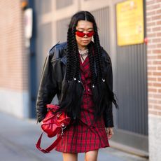 girl wearing plaid red dress and leather dress
