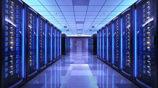 A corridor in a blue-hued data centre