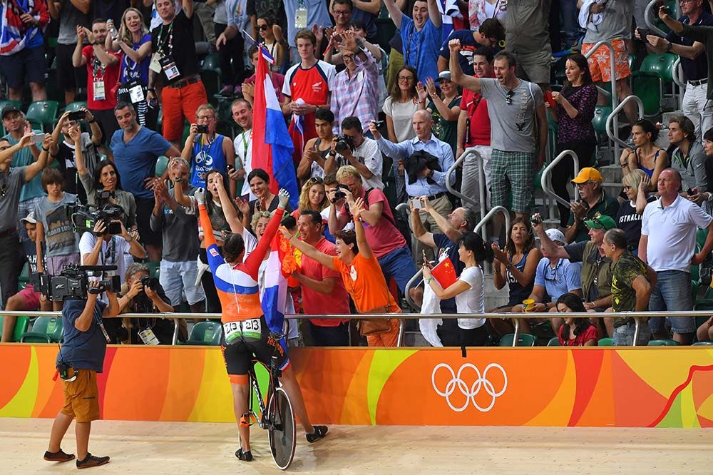Elis Ligtlee celebrates with the Netherlands fans in the velodrome