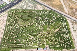 The maze is one of seven corn mazes across the United States by farms participating in the Space Farm 7 project in 2011. Featured at the bottom is a giant Mars rover.