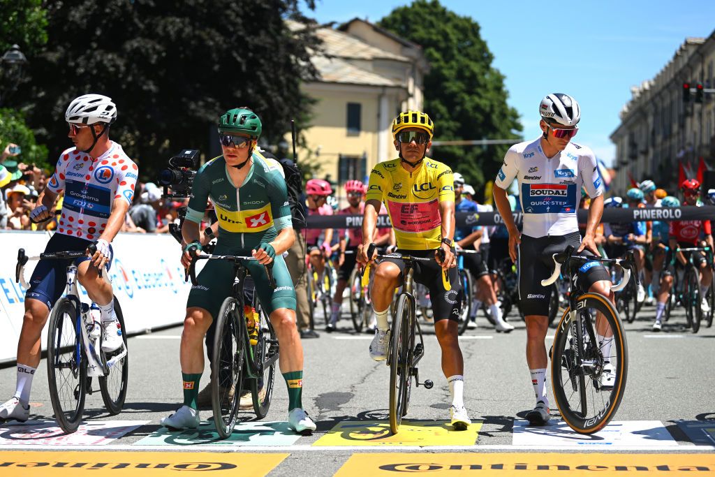 PINEROLO ITALY JULY 02 LR Valentin Madouas of France and Team Groupama FDJ Polka Dot Mountain Jersey Jonas Abrahamsen of Norway and Team UnoX Mobility Green Sprint Jersey Richard Carapaz of Ecuador and Team EF Education EasyPost Yellow Leader Jersey and Remco Evenepoel of Belgium and Team Soudal QuickStep White Best Young Rider Jersey prior to the 111th Tour de France 2024 Stage 4 a 1394km stage from Pinerolo to Valloire UCIWT on July 02 2024 in Pinerolo Italy Photo by Dario BelingheriGetty Images