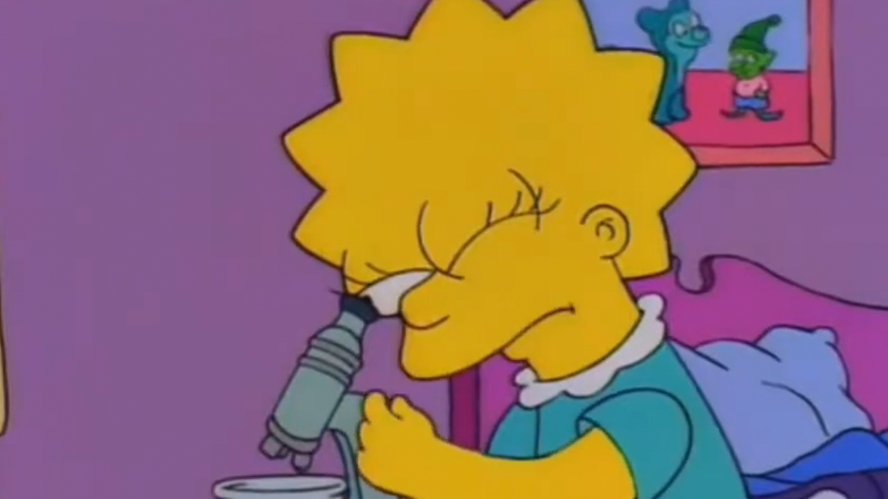 Lisa Simpson looking into a microscope