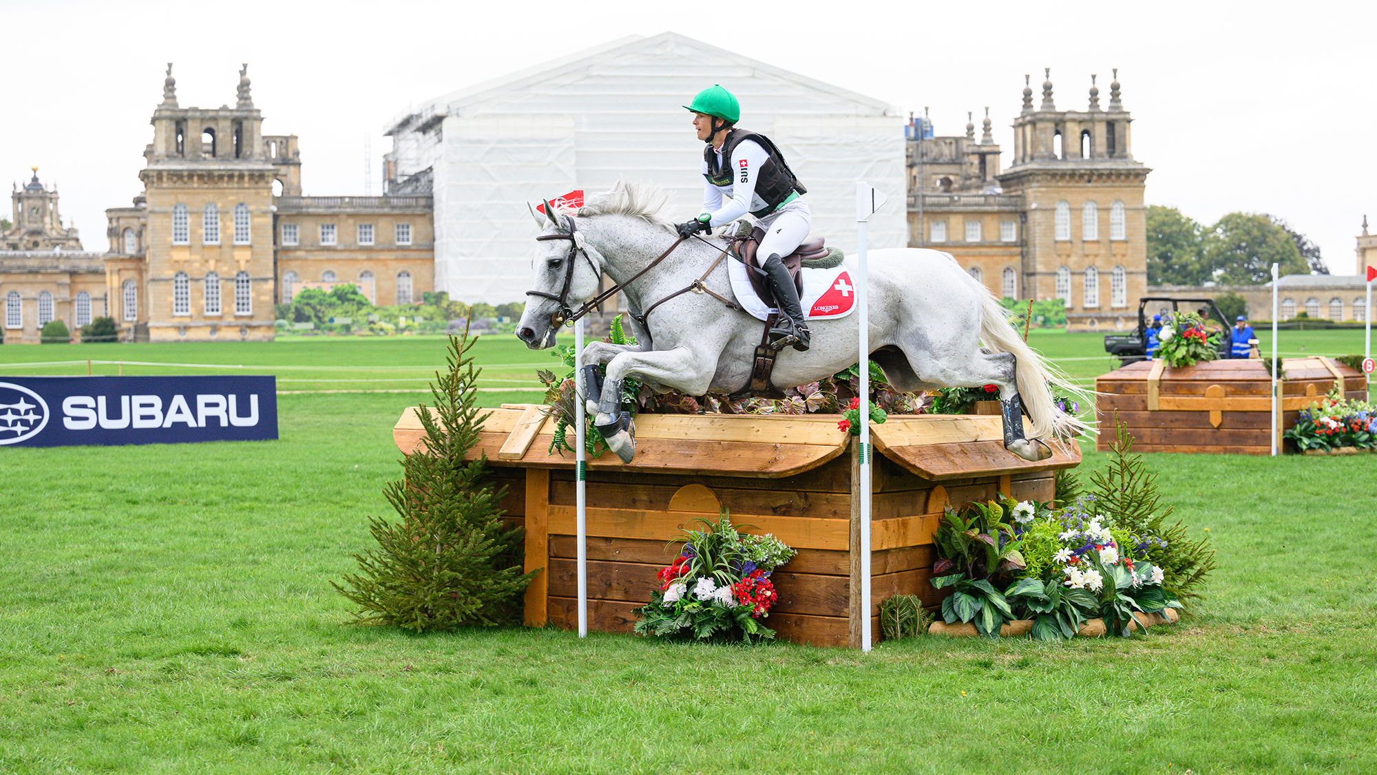 M&eacute;lody Johner and Erin jump a cross-country fence in front of Blenheim Palace at the 2025 European Championships
