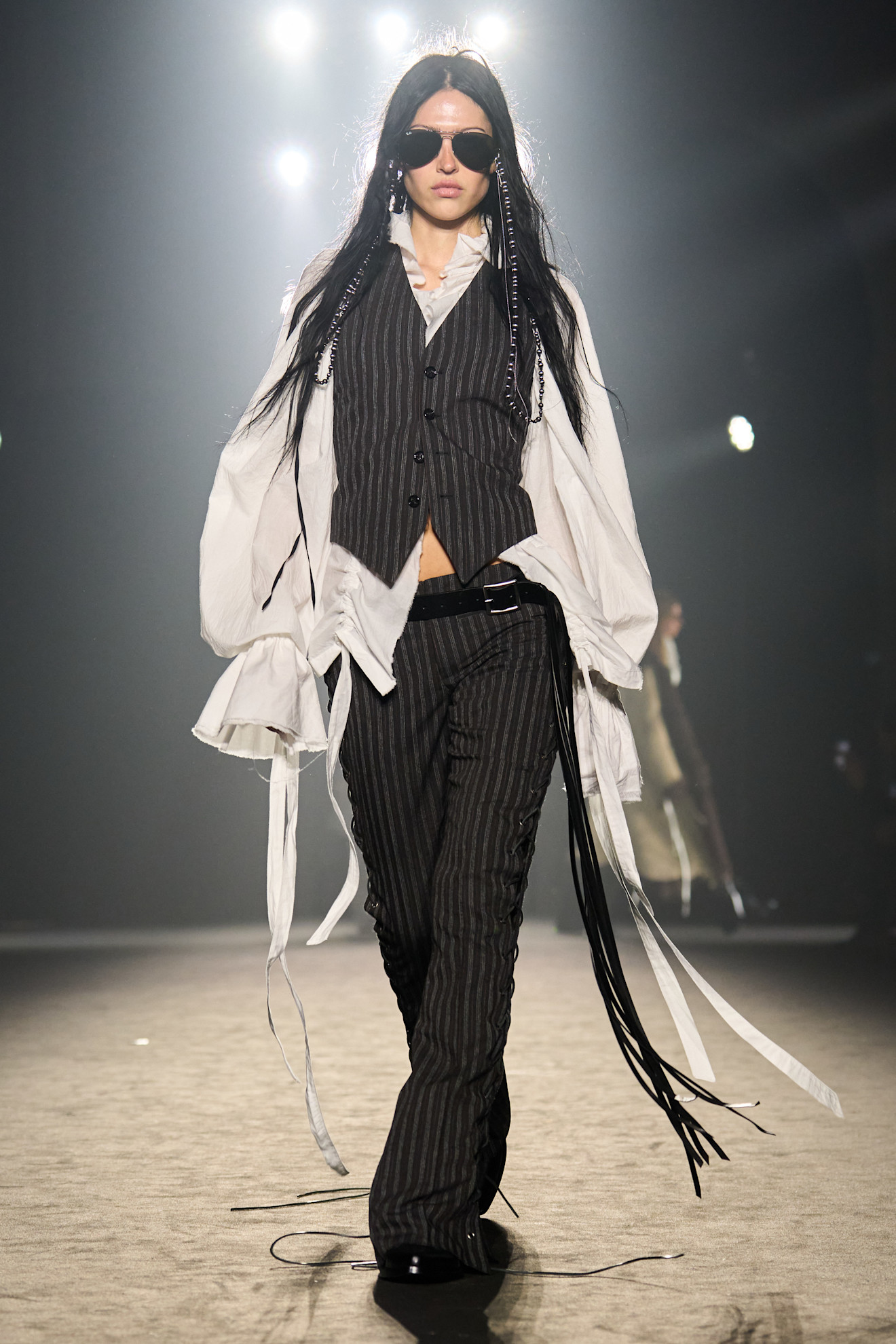 A model wore Jenna Ortega's pinstripe two-piece on the Ann Demeulemeester Fall 2025 runway