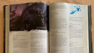 An open D&D Player's Handbook, showing pages of text and illustrations of characters being swallowed by darkness, as well as an ice knife on the other side