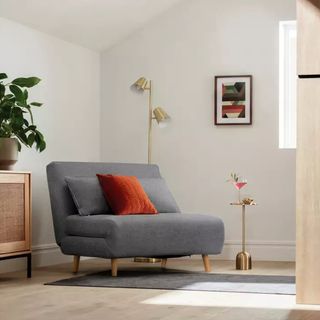 The Habitat Roma sofa bed in grey upholstery in a small living room
