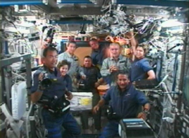 Discovery Docks at Space Station, Nine Astronauts Aboard ISS