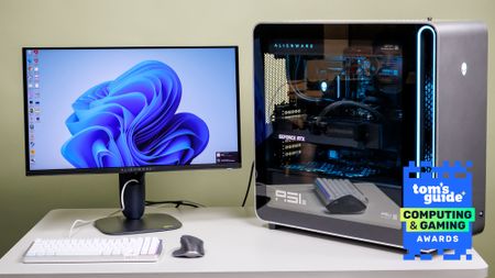 A desktop PC and a monitor on a table with a Tom's Guide Computing and Gaming Awards 2026 badge