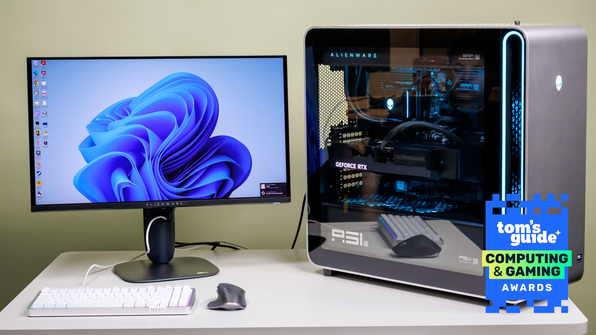A desktop PC and a monitor on a table with a Tom's Guide Computing and Gaming Awards 2026 badge