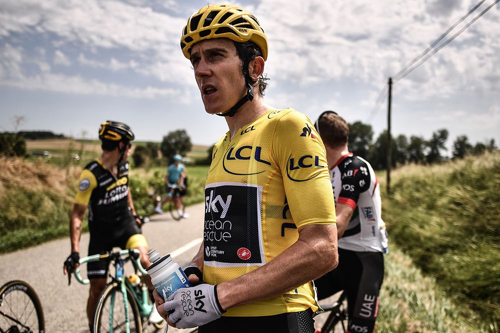 Geraint Thomas stopped to clean his eyes from tear gas that accidentally sprayed the peloton after police used it to stop protesters