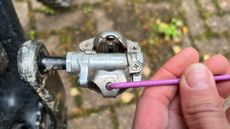 Using a 5mm key to adjust the tension on a Shimano SPD pedal spring