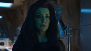 She-Hulk has a concerned expression on her face as she stands in Smart Hulk's lab in her Disney Plus show