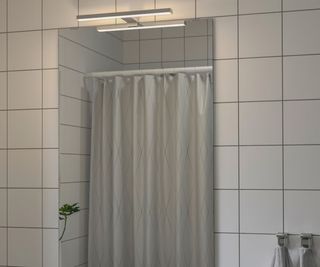 An IKEA Lettan mirror in a contemporary bathroom