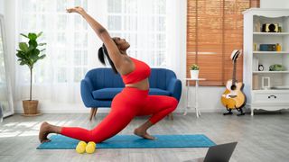 Woman going into a lunge from warrior pose, as suggested to do in yoga as a workout