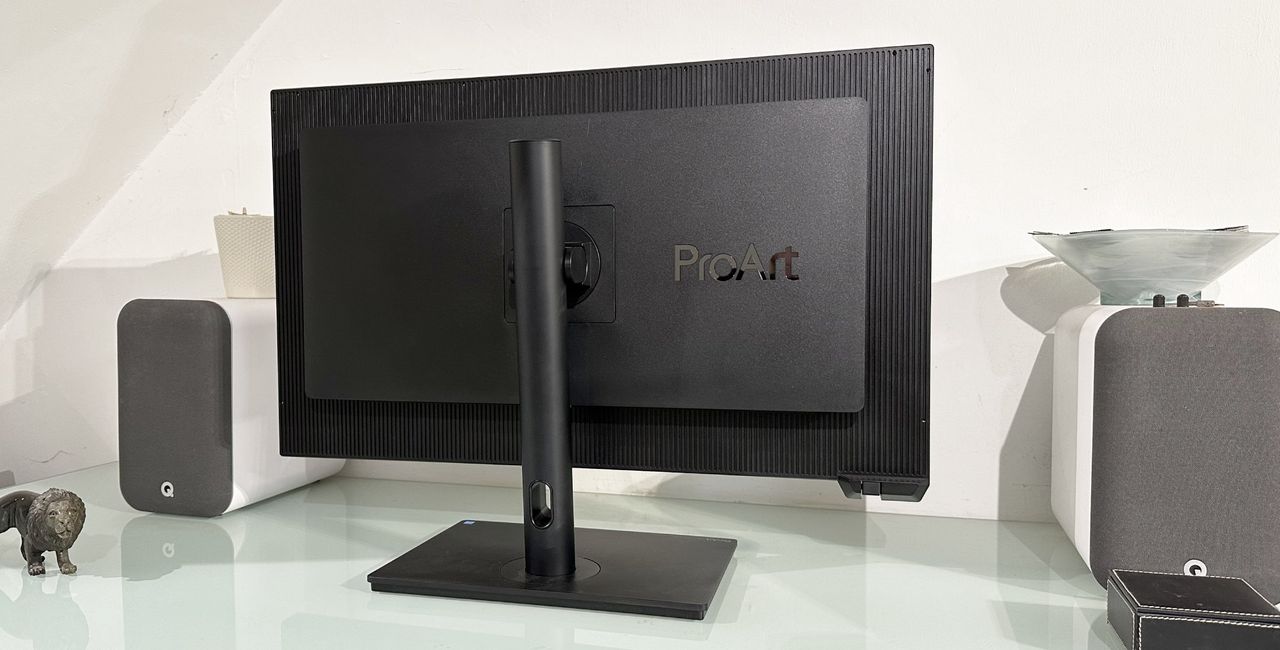 The Asus ProArt PA32KCX 8K monitor on a white desk in a home office during our review process