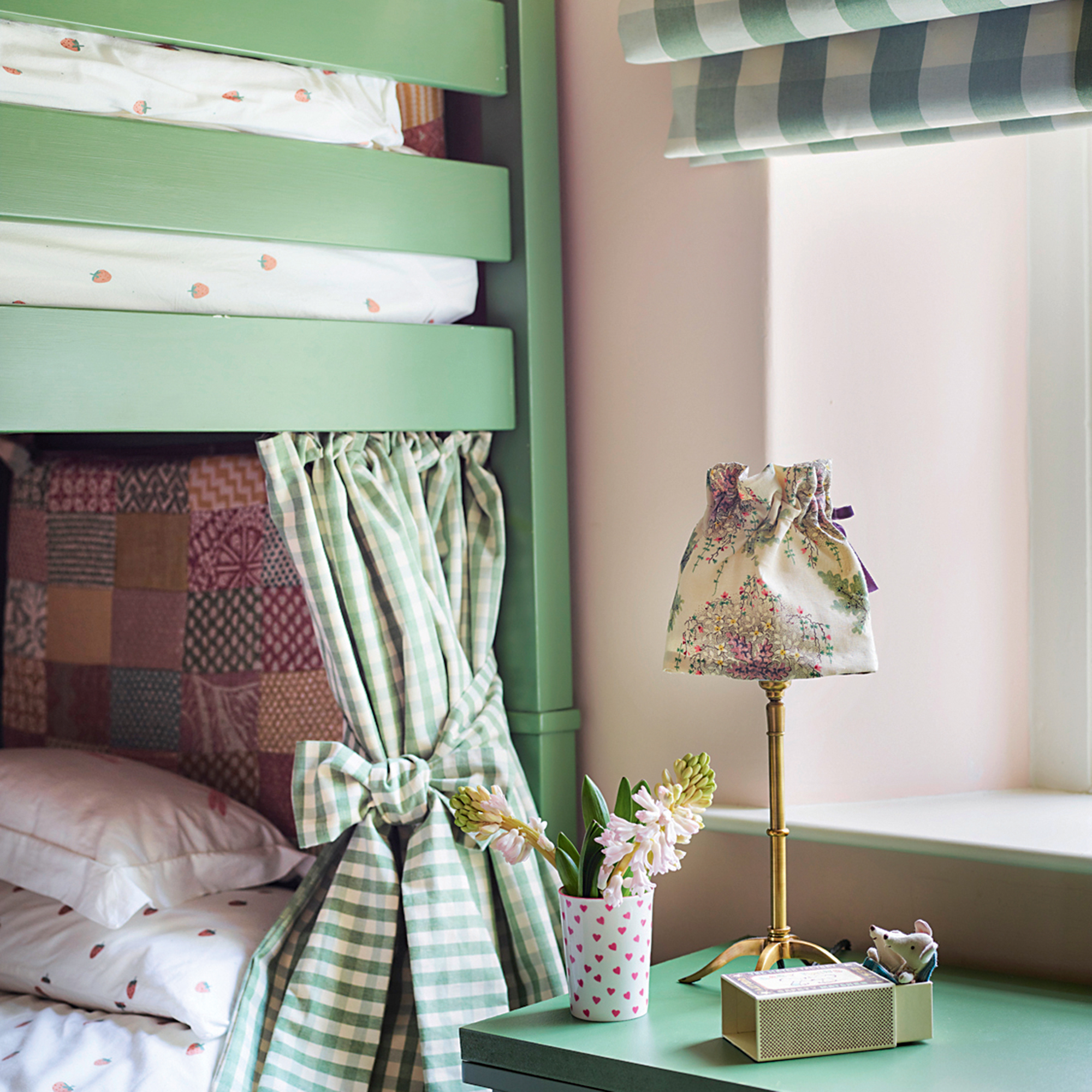 green painted bunk bed and desk with green gingham blind and curtains in children's room