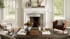 McGee & Co. fall decor, including a large wooden coffee table, armchairs, and decorative woven boxes, styled in a sunlit liivng room