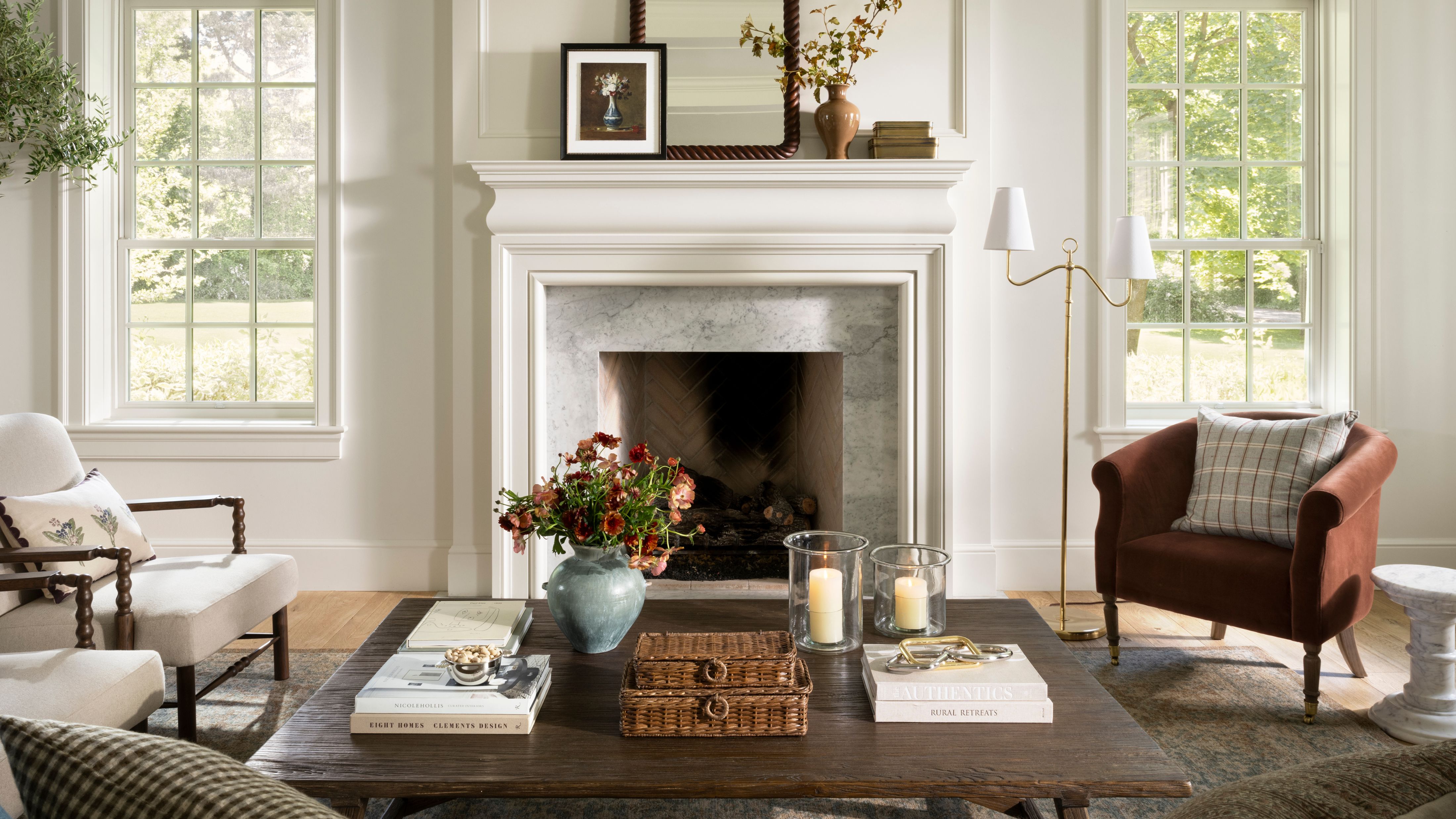 McGee &amp; Co. fall decor, including a large wooden coffee table, armchairs, and decorative woven boxes, styled in a sunlit liivng room
