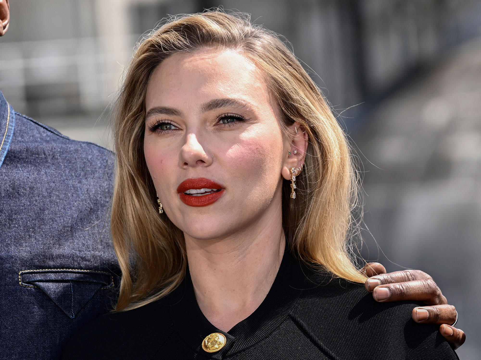 Scarlett Johansson wears a black miniskirt