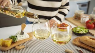 Woman pouring a glass of wine