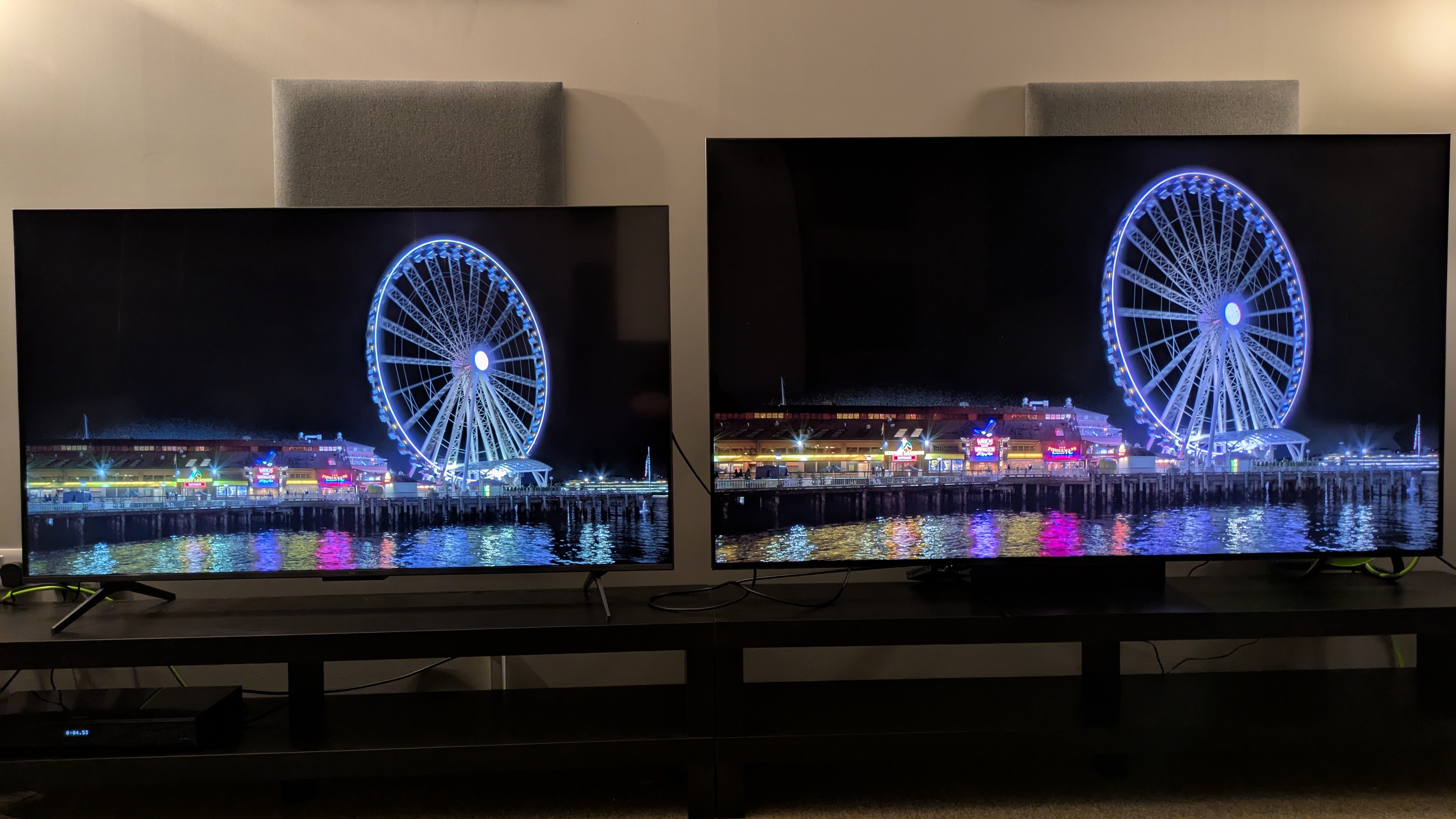 TCL C6K (left) and TCL C6K (right) showing Ferris wheel at night on quay