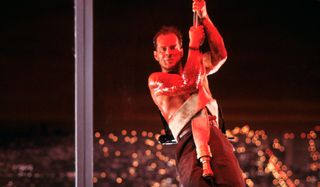 Die Hard John McClane hanging on a fire hose