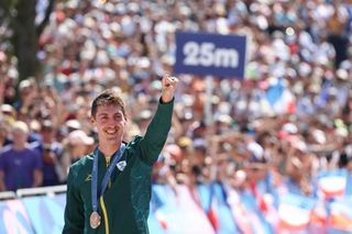 South Africa's Alan Hatherly celebrates his bronze medal on the podium after the men's cross-country mountain biking event during the Paris 2024 Olympic Games in Elancourt Hill venue in Elancourt, on July 29, 2024. (Photo by Emmanuel DUNAND / AFP)