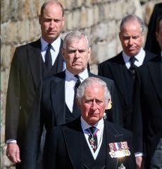 King Charles, Prince William and Prince Andrew walking in a row at Prince Philip's funeral