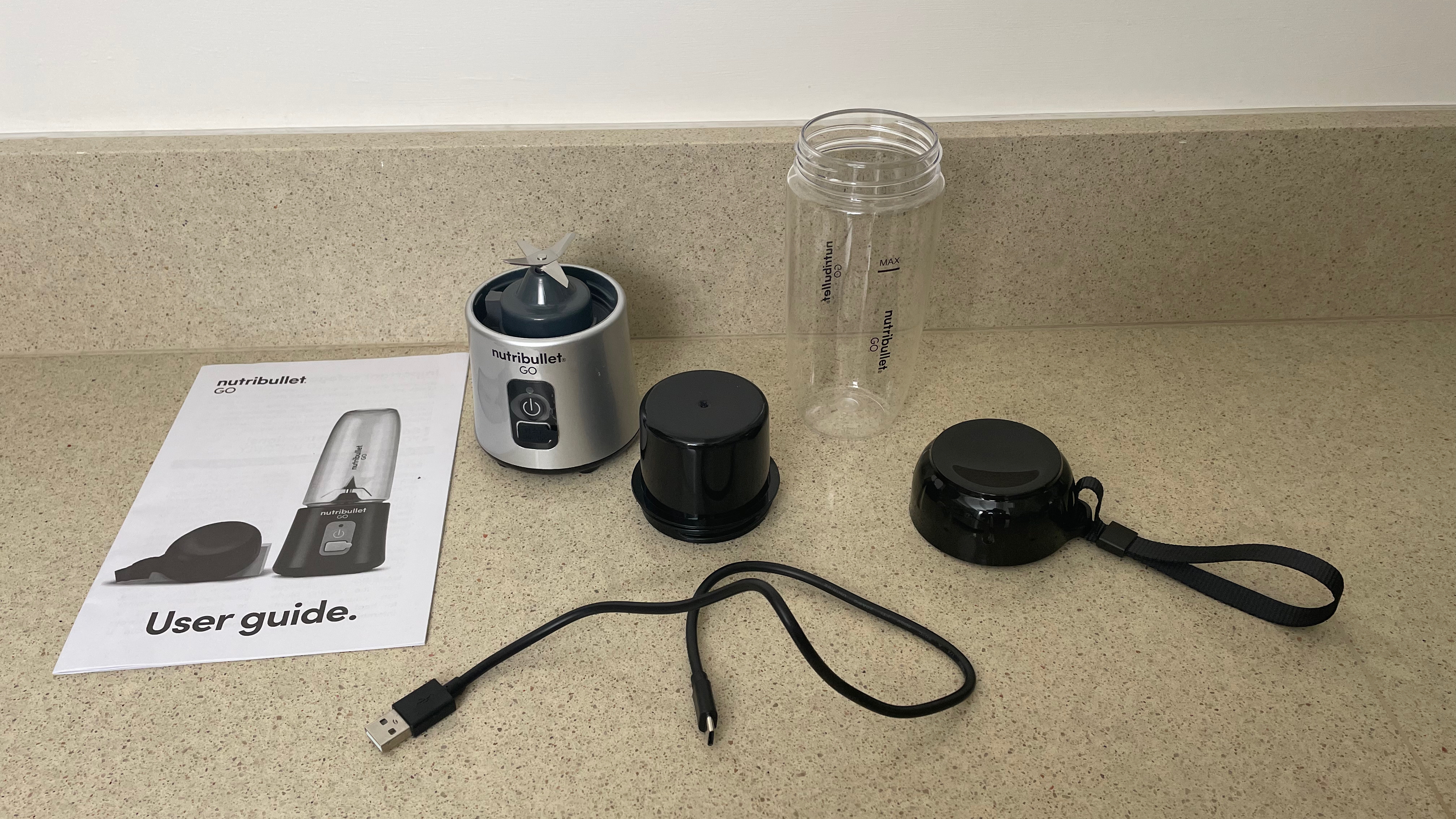 Nutribullet Go components and instruction manual on a counter