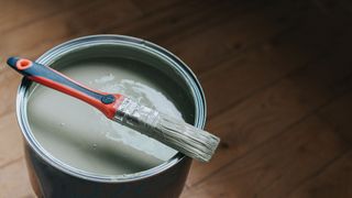 picture of grey paint with brush resting on top