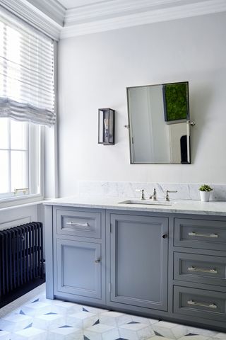White bathroom with a grey vanity unit with a marble countertop